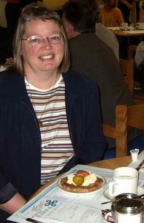 Karen Autio having piirakka at the Hoito